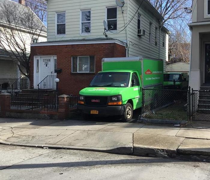 a green van in a driveway