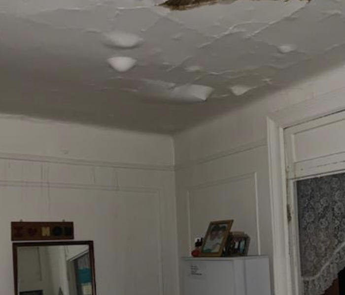 a white ceiling with a portion missing