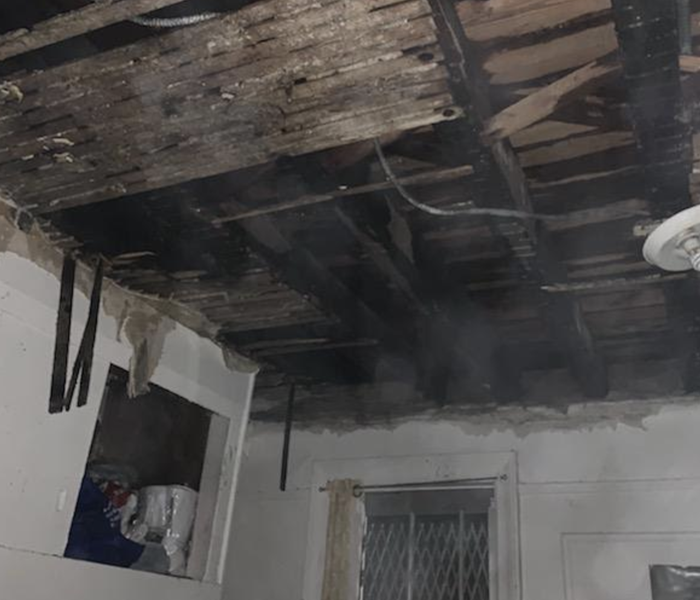 a black ceiling with fire damage